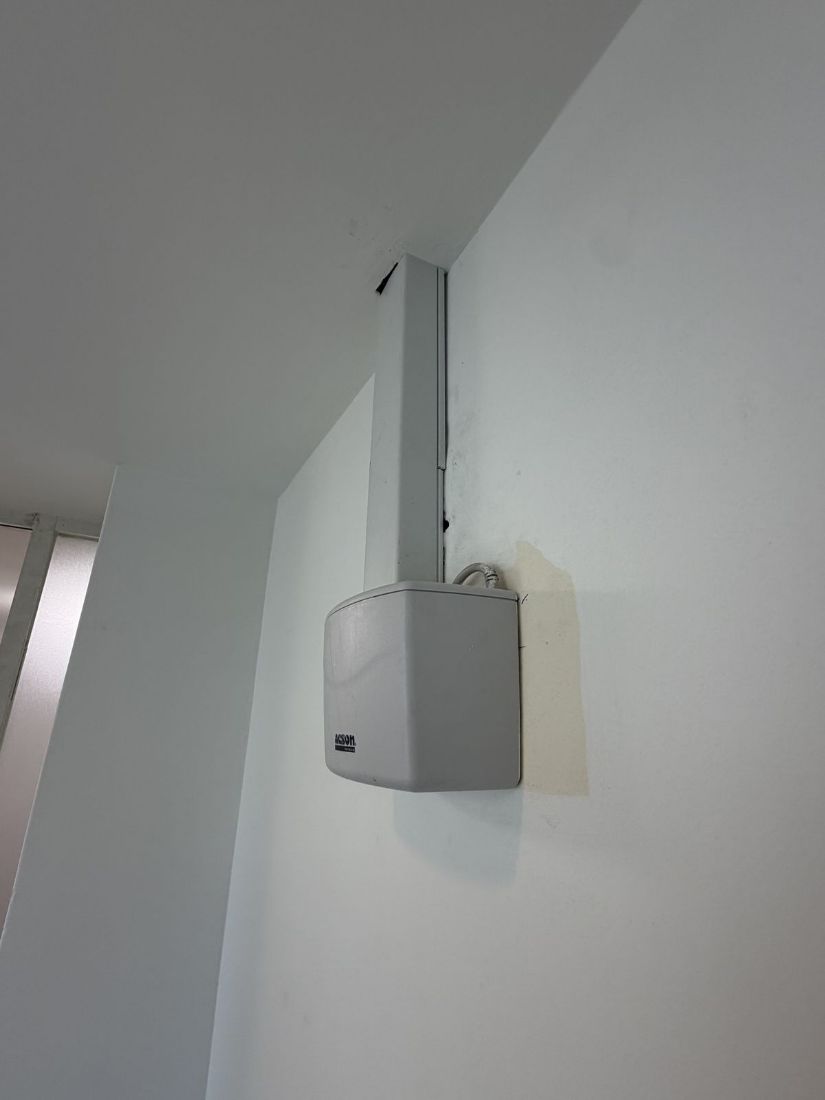 Acson drainage pump mounted on the dry kitchen wall